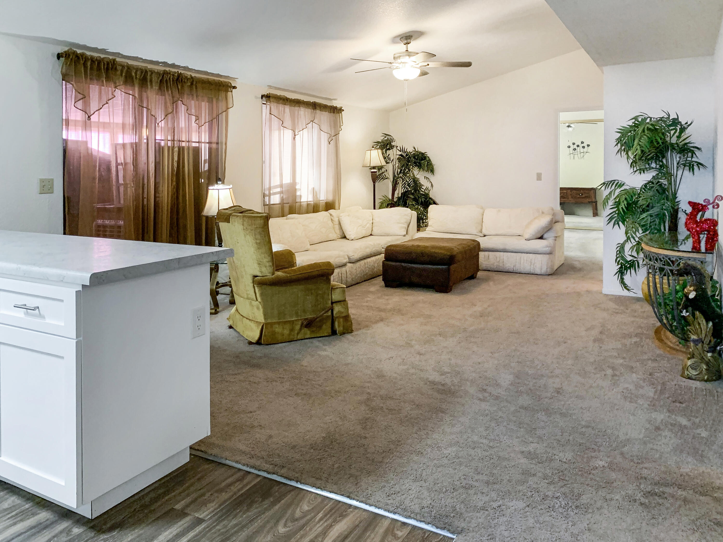 47685 Prado Way Indio, CA 92201 - Photo 7 of 26 a living room with furniture and a chandelier