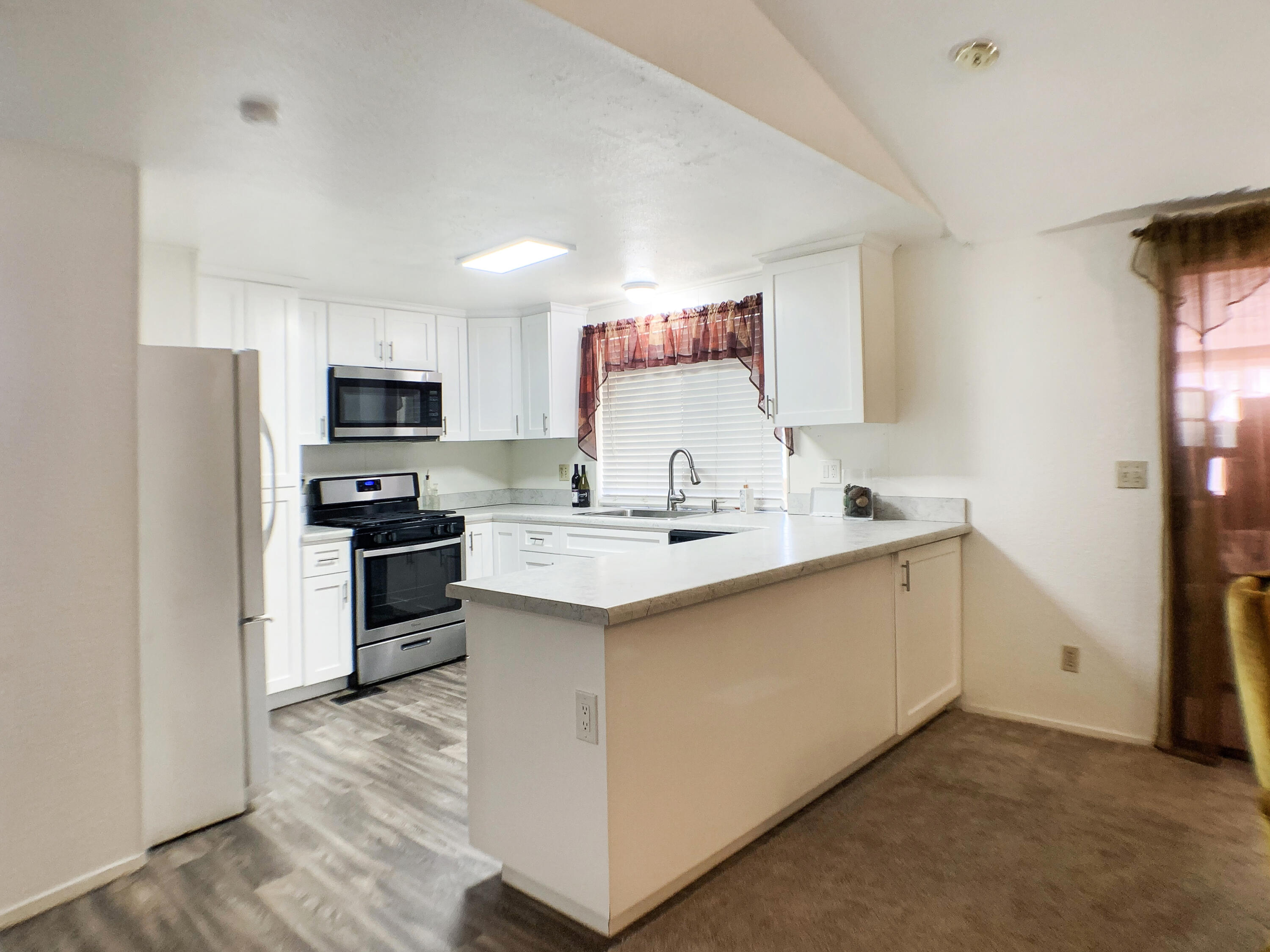 47685 Prado Way Indio, CA 92201 - Photo 9 of 26 a kitchen with a sink appliances and cabinets