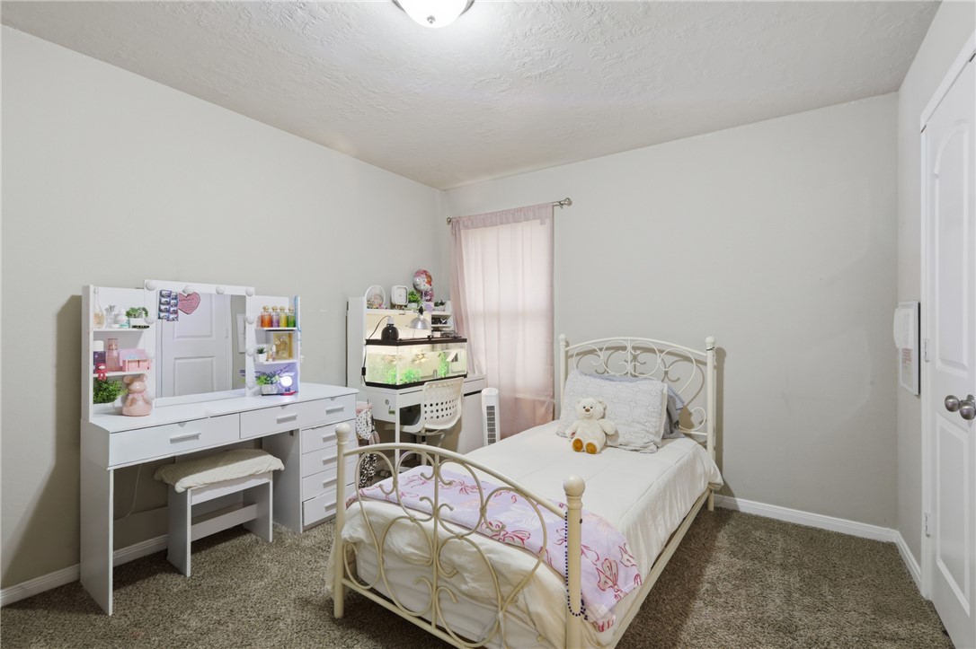 2725 Porter's Way Bryan, TX 77803 - Photo 17 of 19 a bedroom with a bed and a desk