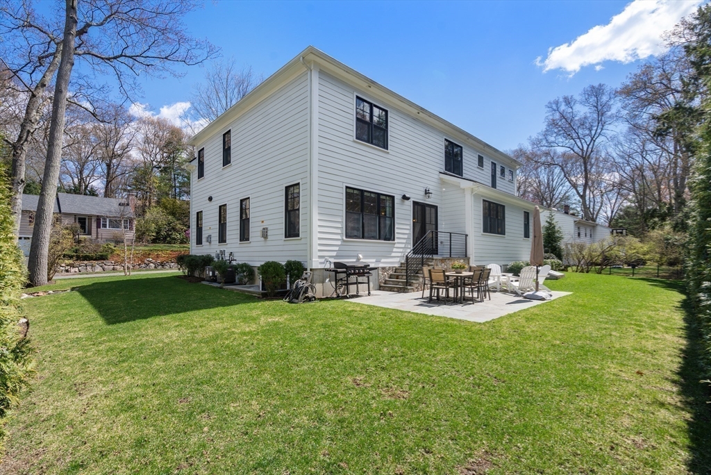 7 Massasoit Road Wellesley, MA 02481 - Photo 40 of 42 a view of a house with backyard and sitting area