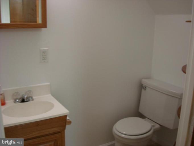 8013 Kimberly Road Dundalk, MD 21222 - Photo 11 of 12 a white toilet sitting next to a white sink