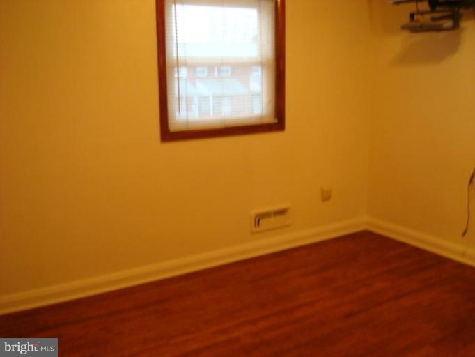 8013 Kimberly Road Dundalk, MD 21222 - Photo 7 of 12 an empty room with a window