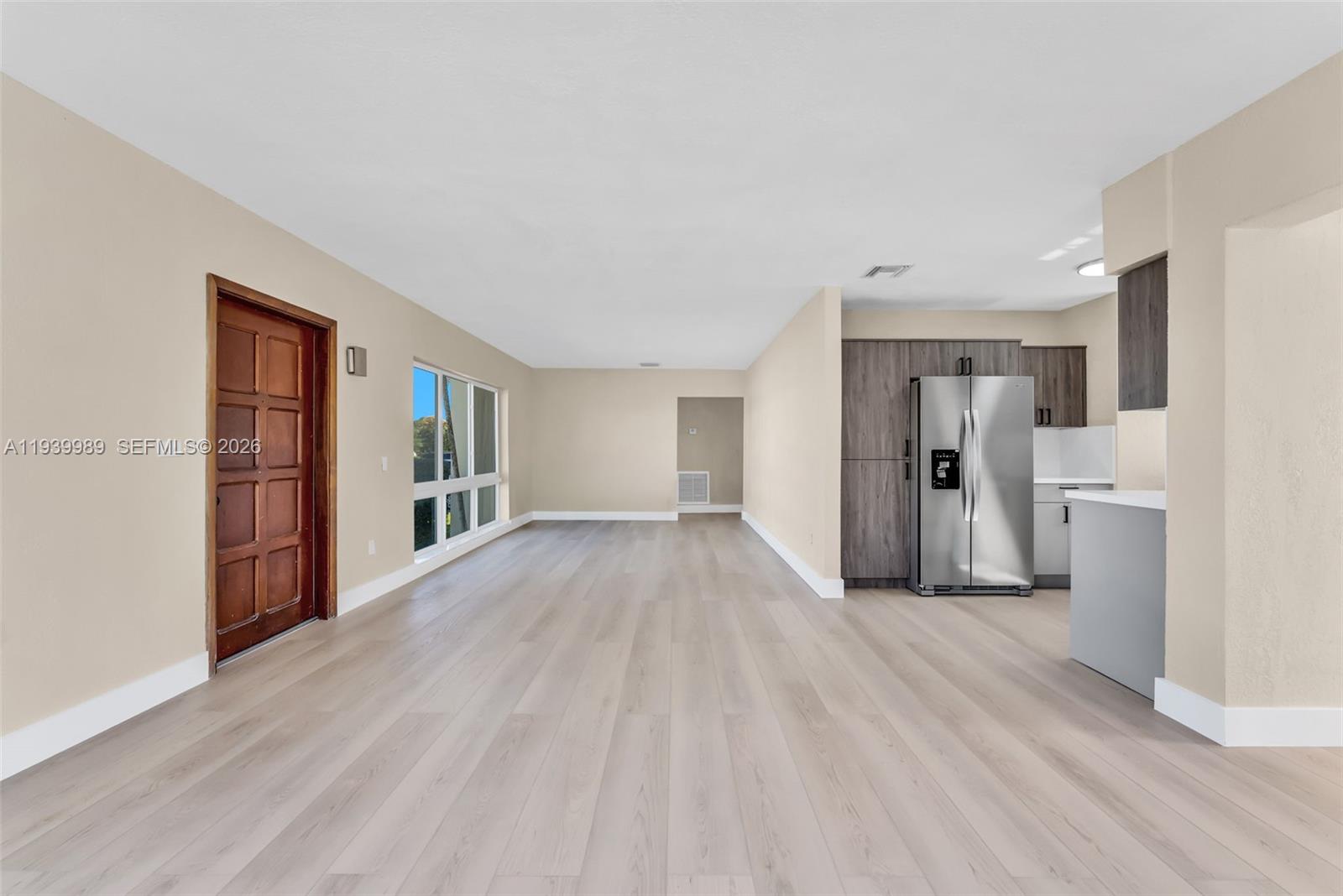 40 West 58th Street Hialeah, FL 33012 - Photo 11 of 25 a view of empty room with wooden floor