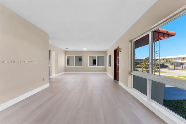 a view of a living room with a large window