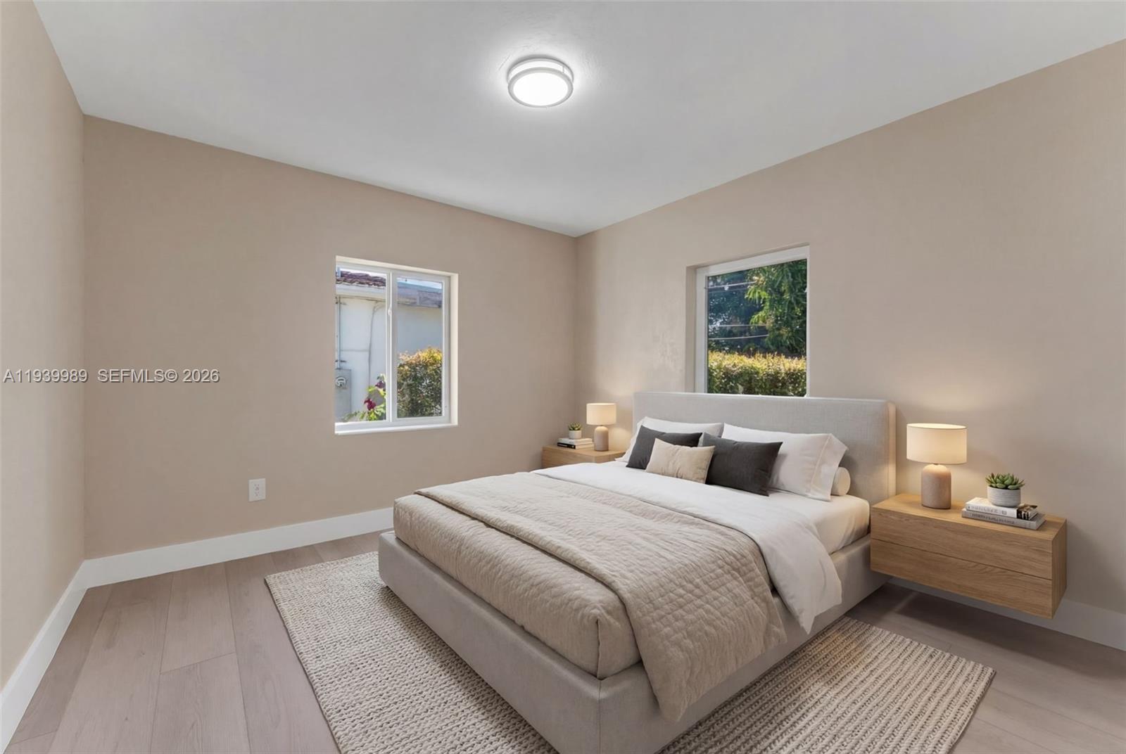 40 West 58th Street Hialeah, FL 33012 - Photo 18 of 25 a bedroom with a bed and a window