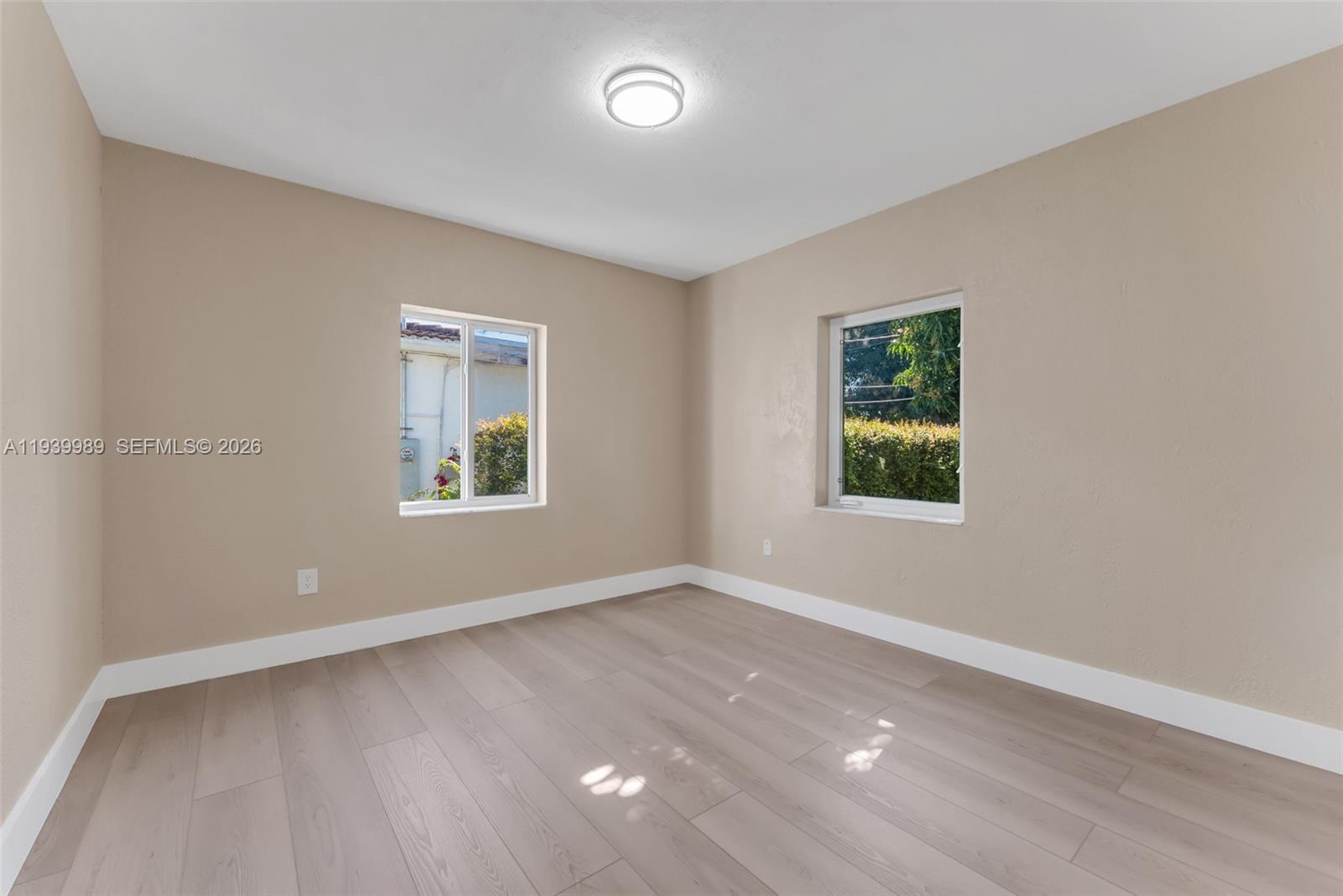 40 West 58th Street Hialeah, FL 33012 - Photo 19 of 25 an empty room with a window
