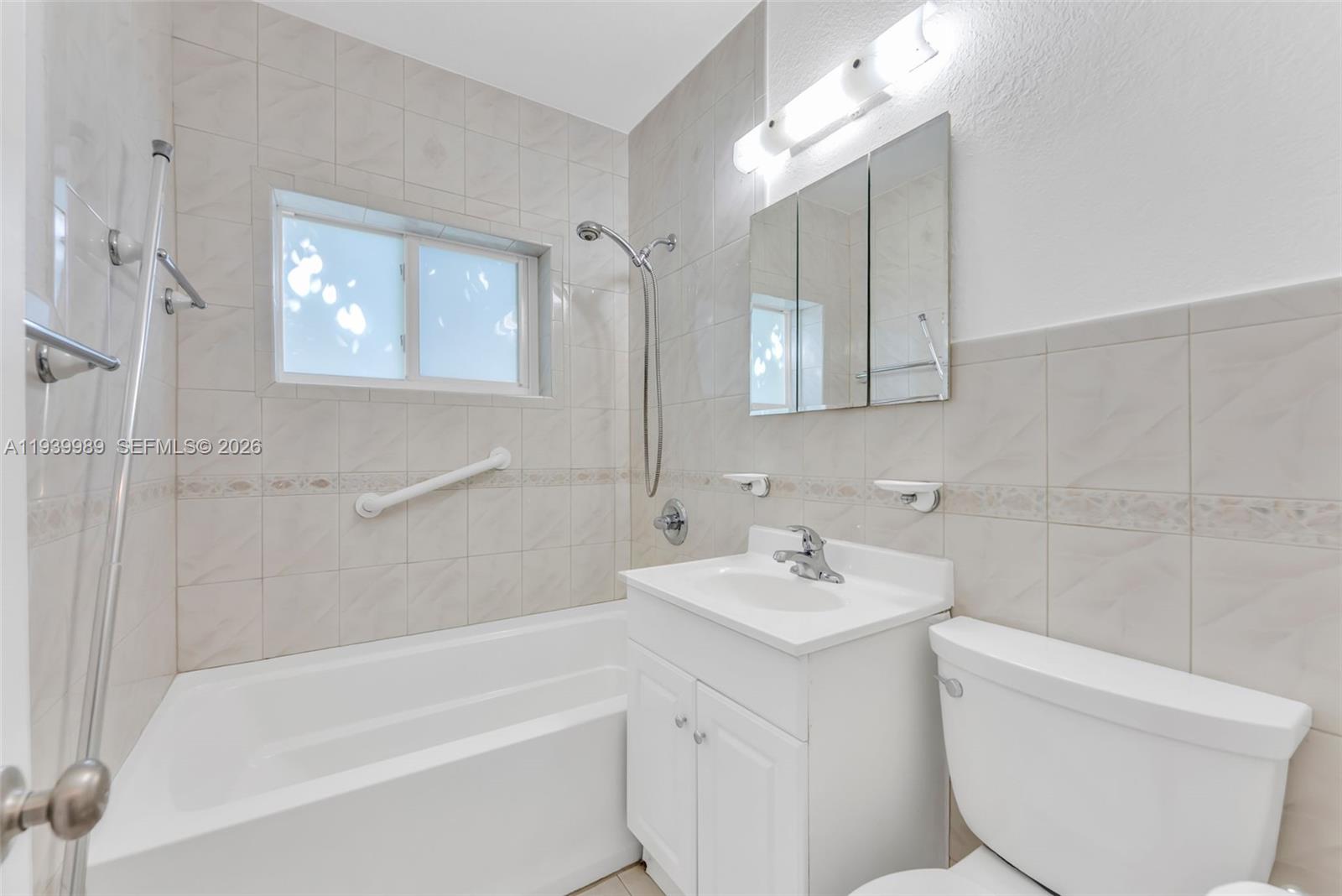 40 West 58th Street Hialeah, FL 33012 - Photo 21 of 25 a bathroom with a sink toilet and shower