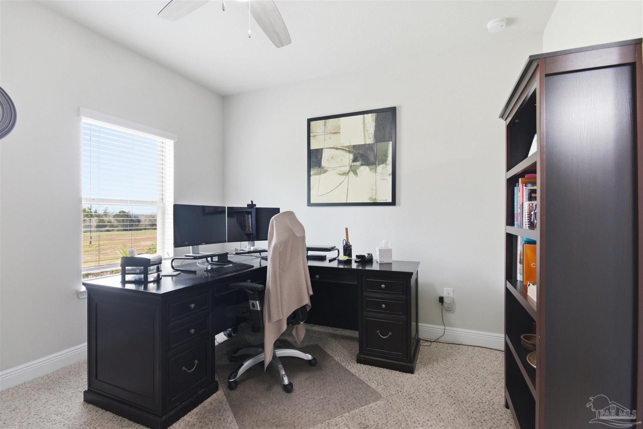 2677 Tulip Hill Road Pace, FL 32571 - Photo 24 of 35 a view of a workspace with furniture