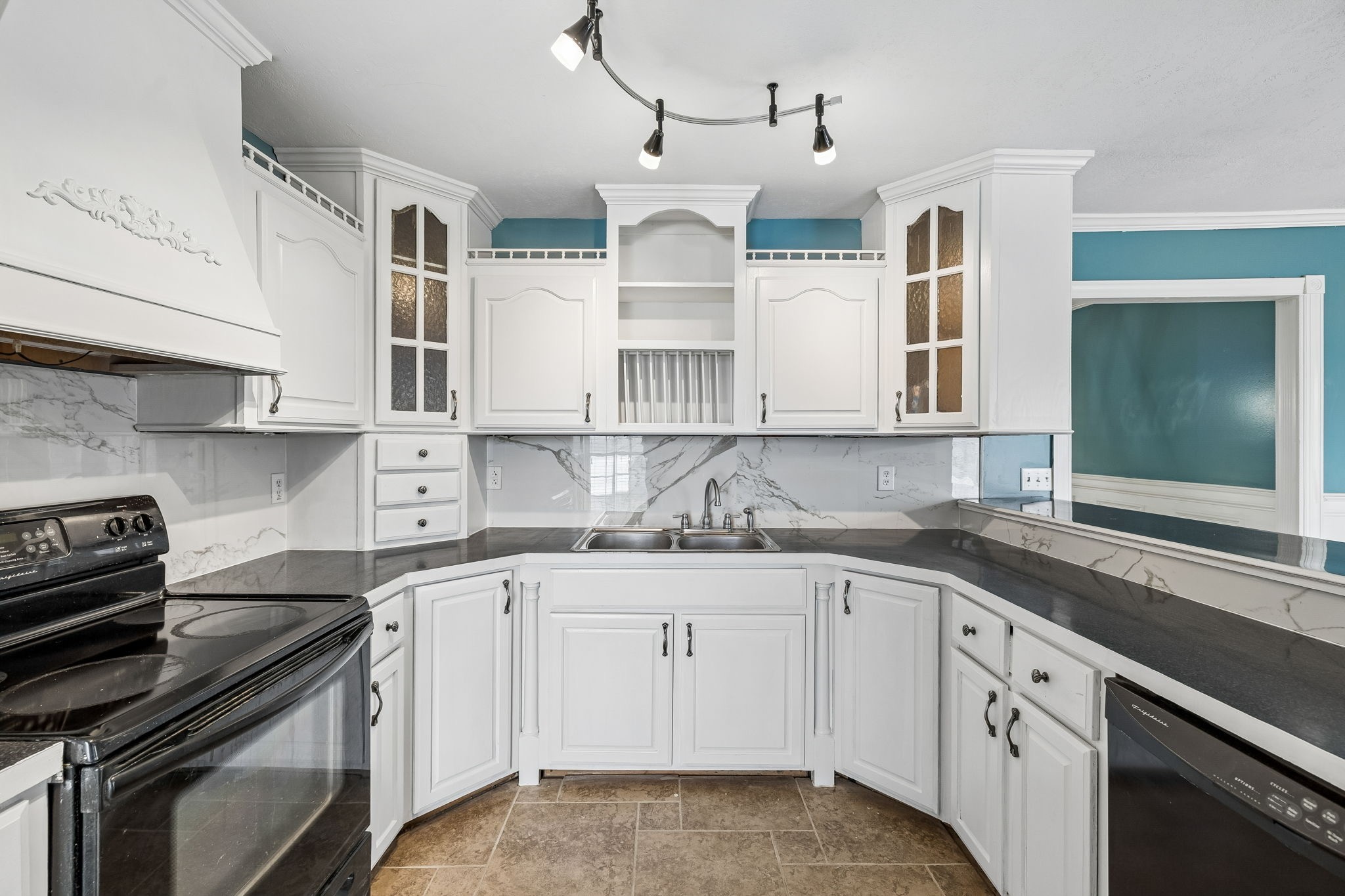 6701 McCormick Ridge Road Whitleyville, TN 38588 - Photo 19 of 63 a kitchen with stainless steel appliances granite countertop a sink and cabinets