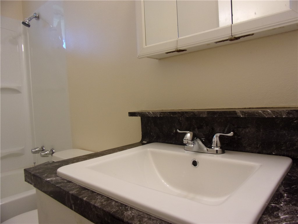 3034 Sunnybrook Road Corpus Christi, TX 78415 - Photo 12 of 20 a bathroom with a sink
