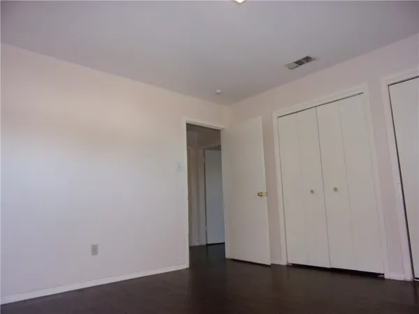 a view of a livingroom with wooden floor