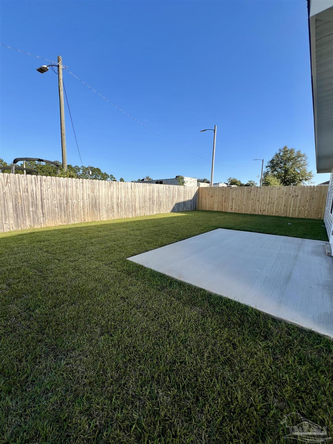 3327 Bliss Lane, Unit 12E Cantonment, FL 32533 - Photo 14 of 15 a view of a field with a big yard
