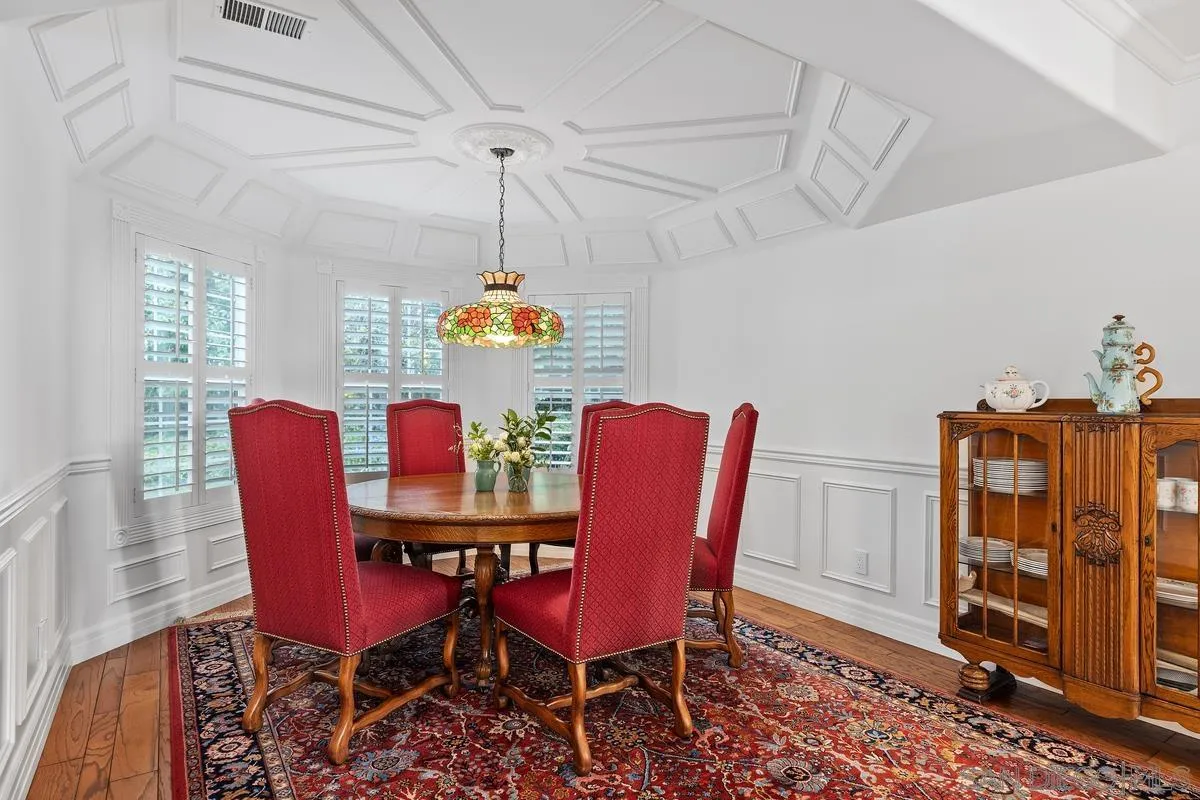 1642 Kings Way Vista, CA 92084 - Photo 14 of 41 a view of a dining room with furniture window and wooden floor