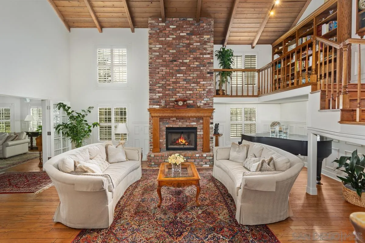 1642 Kings Way Vista, CA 92084 - Photo 17 of 41 a living room with furniture and a fireplace