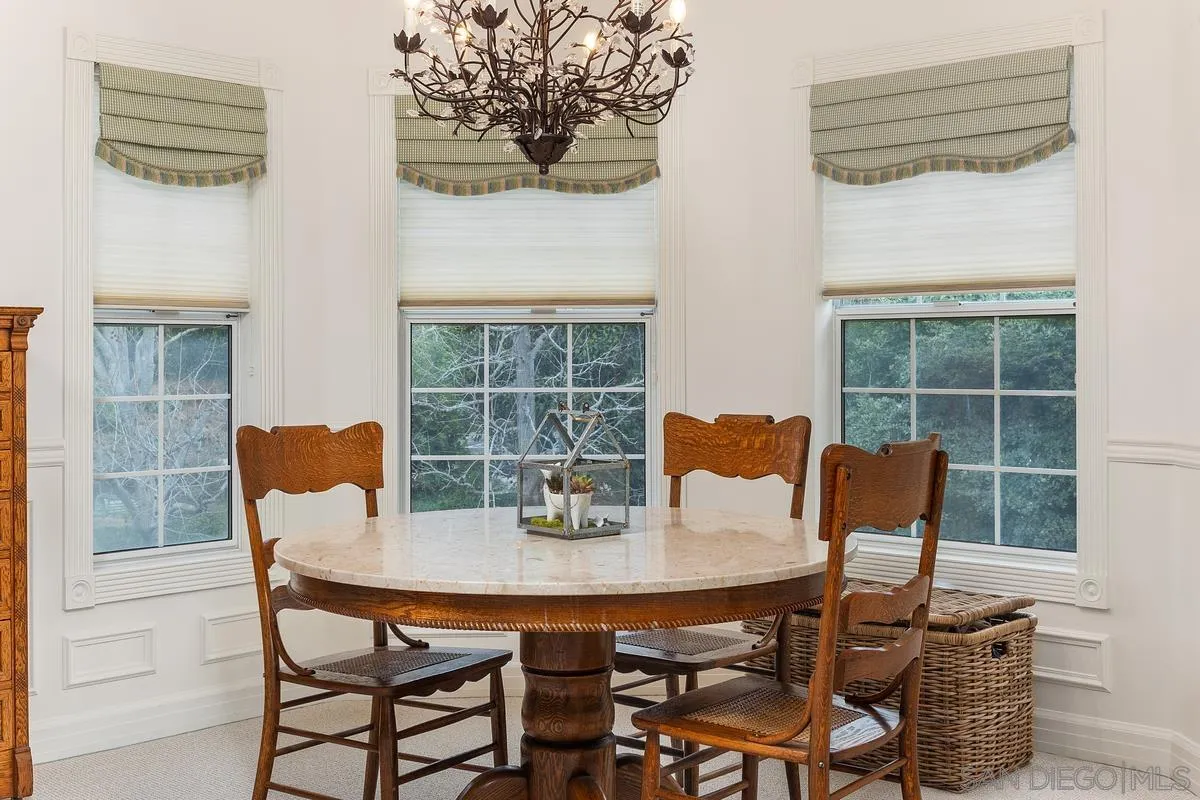 1642 Kings Way Vista, CA 92084 - Photo 21 of 41 a view of a dining room with furniture and wooden floor