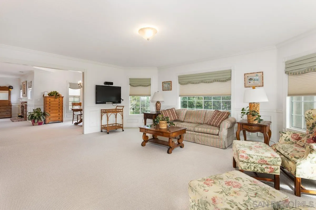 1642 Kings Way Vista, CA 92084 - Photo 22 of 41 a living room with furniture and a flat screen tv