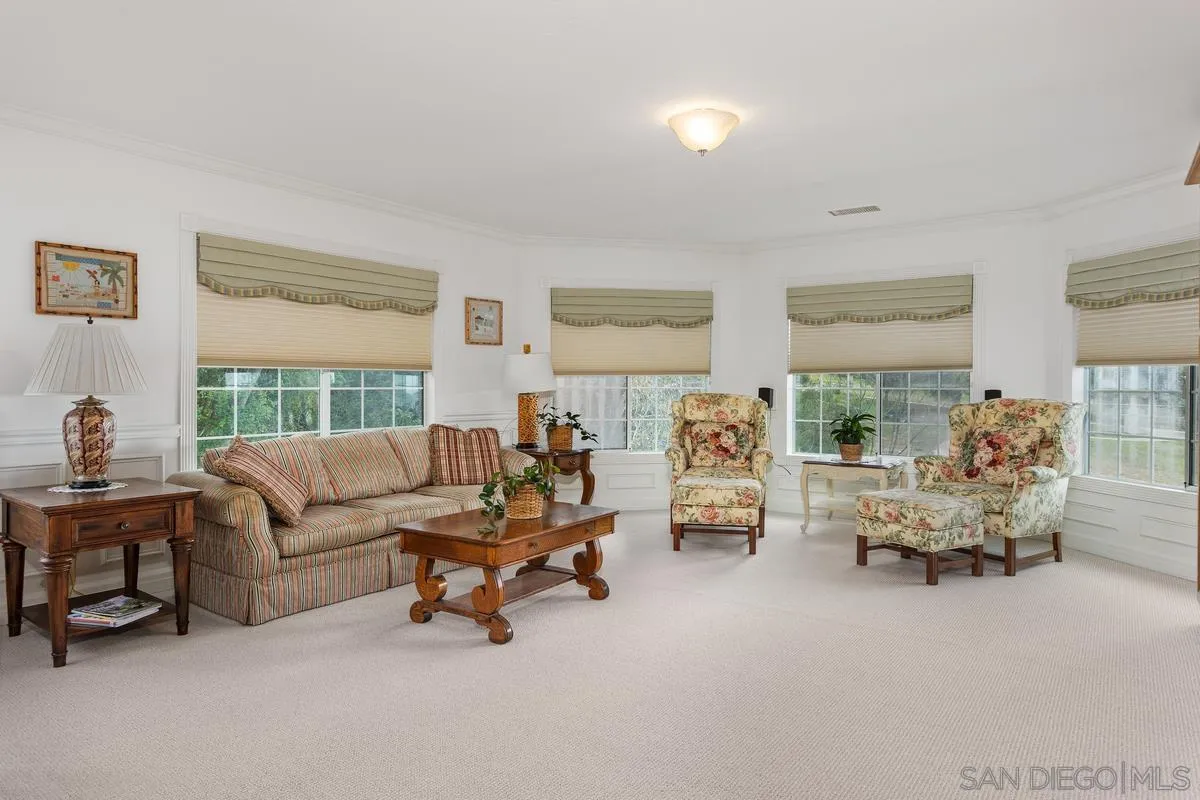 1642 Kings Way Vista, CA 92084 - Photo 25 of 41 a living room with furniture and a large window