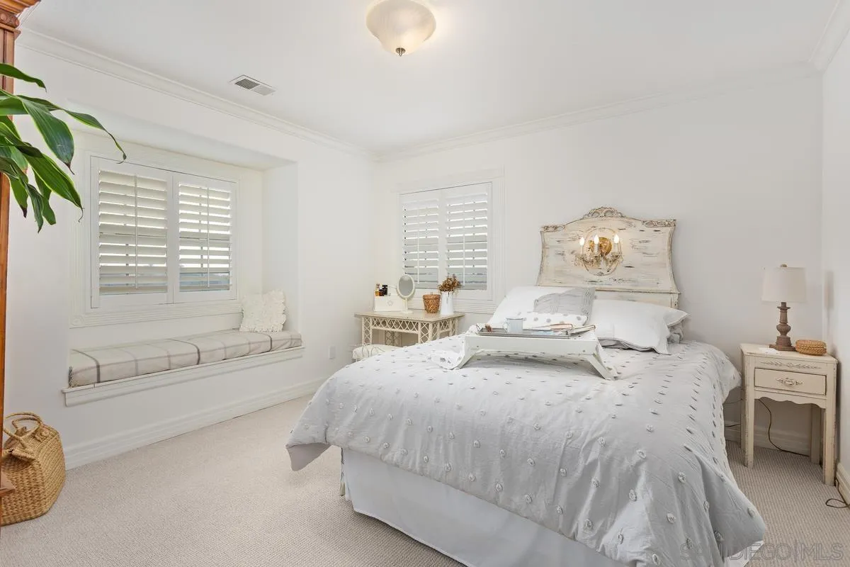 1642 Kings Way Vista, CA 92084 - Photo 27 of 41 a spacious bedroom with a bed and a couch