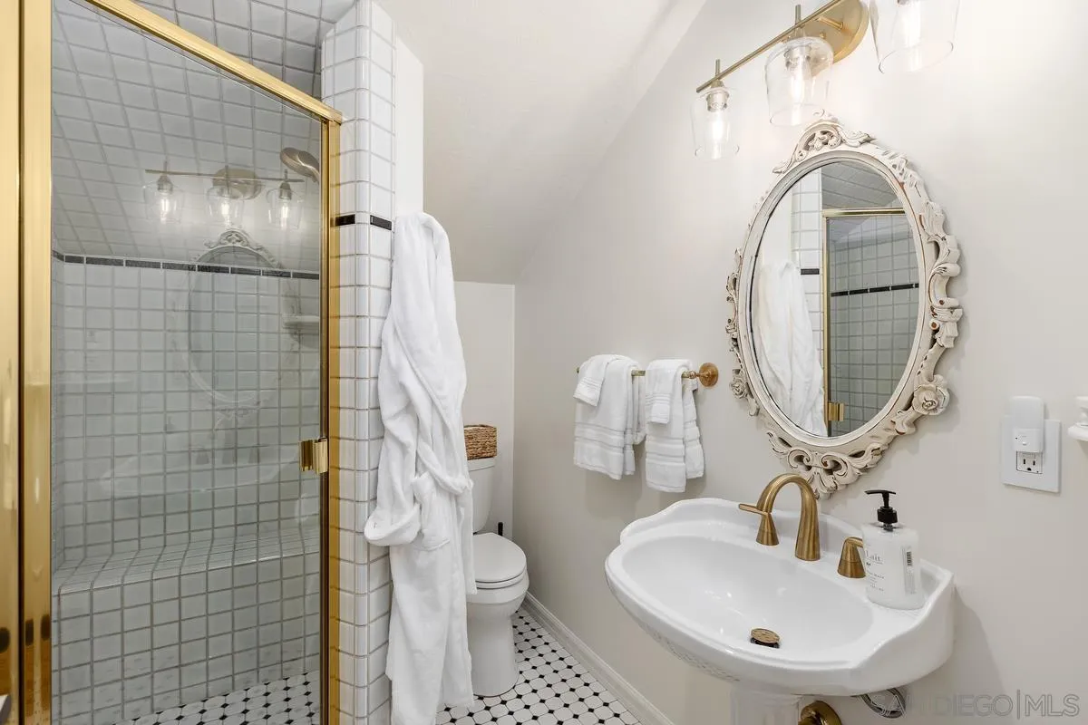 1642 Kings Way Vista, CA 92084 - Photo 29 of 41 a bathroom with a sink a toilet and shower