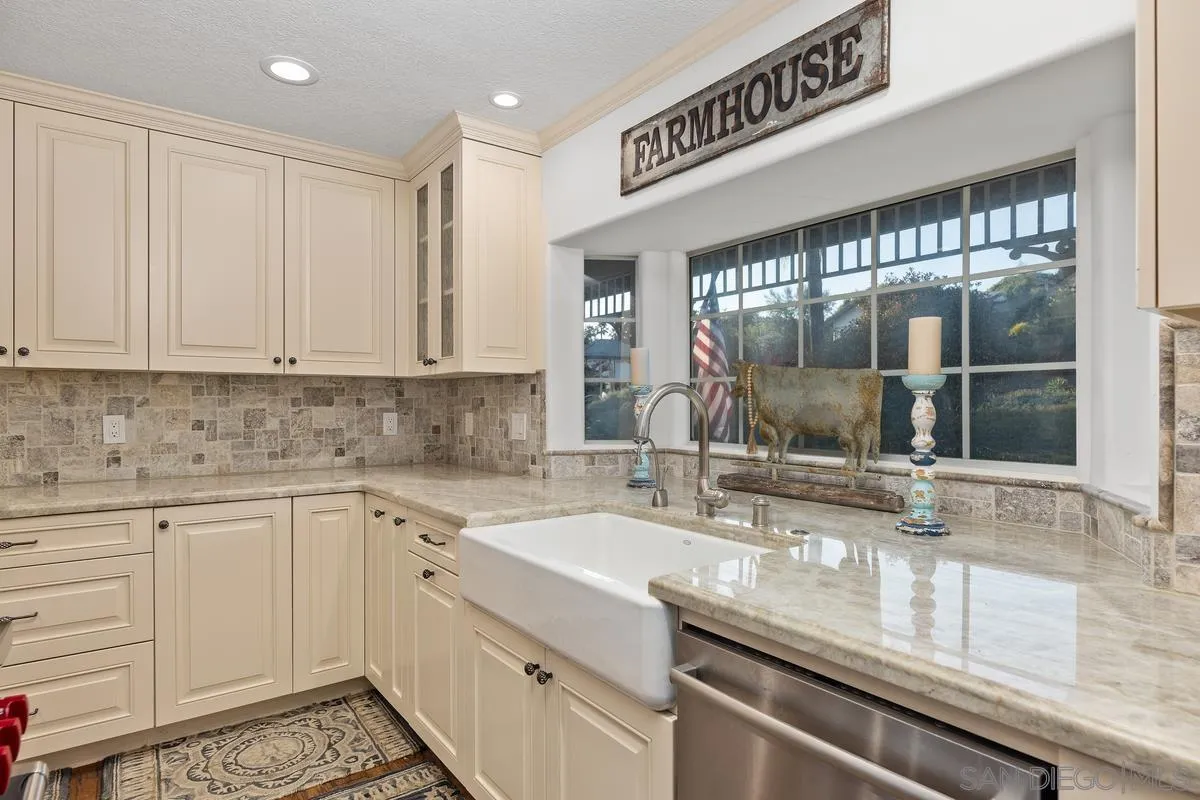 1642 Kings Way Vista, CA 92084 - Photo 9 of 41 a kitchen with a sink and cabinets