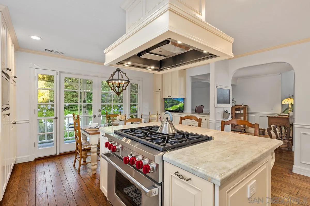 1642 Kings Way Vista, CA 92084 - Photo 10 of 41 a view of a dining room with furniture window and wooden floor