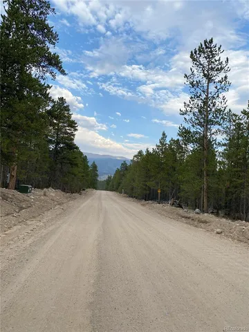 a view of a road with a yard