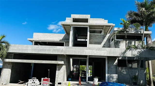 a front view of a house with parking