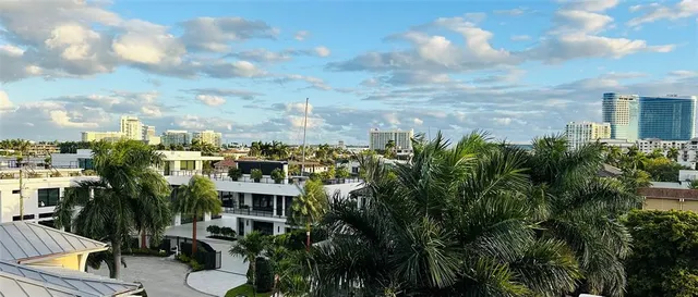 a view of a house with a balcony and sitting area