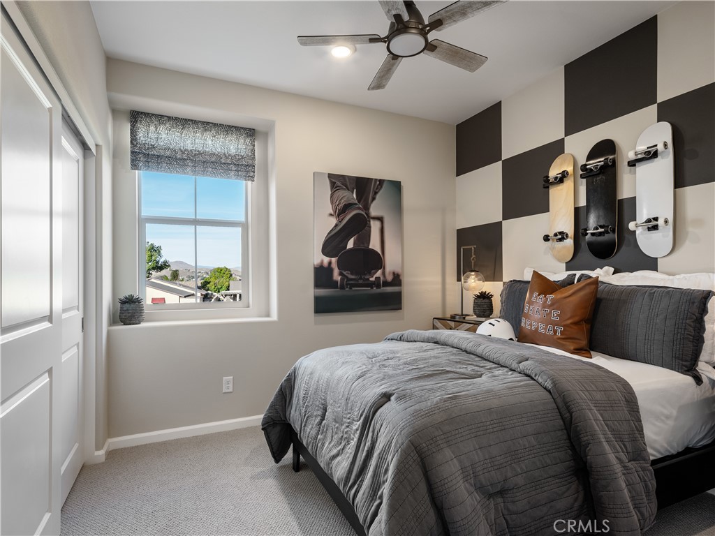 7176 Squall Drive Riverside, CA 92503 - Photo 11 of 15 a bedroom with bed and window