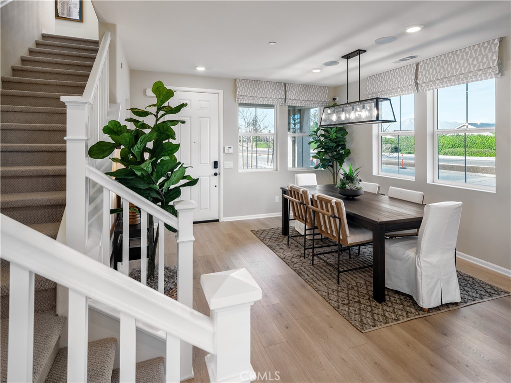 7176 Squall Drive Riverside, CA 92503 - Photo 4 of 15 a living room with furniture and a potted plant