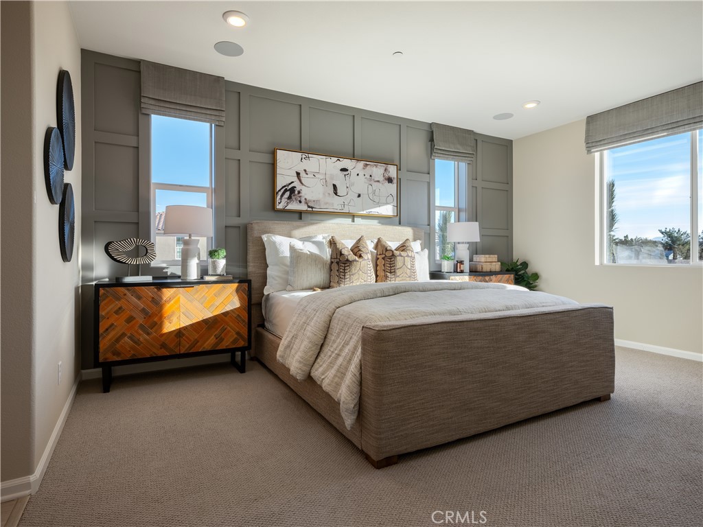 7176 Squall Drive Riverside, CA 92503 - Photo 9 of 15 a bed room with a bed and a couch