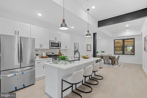 a kitchen with counter space cabinets and stainless steel appliances