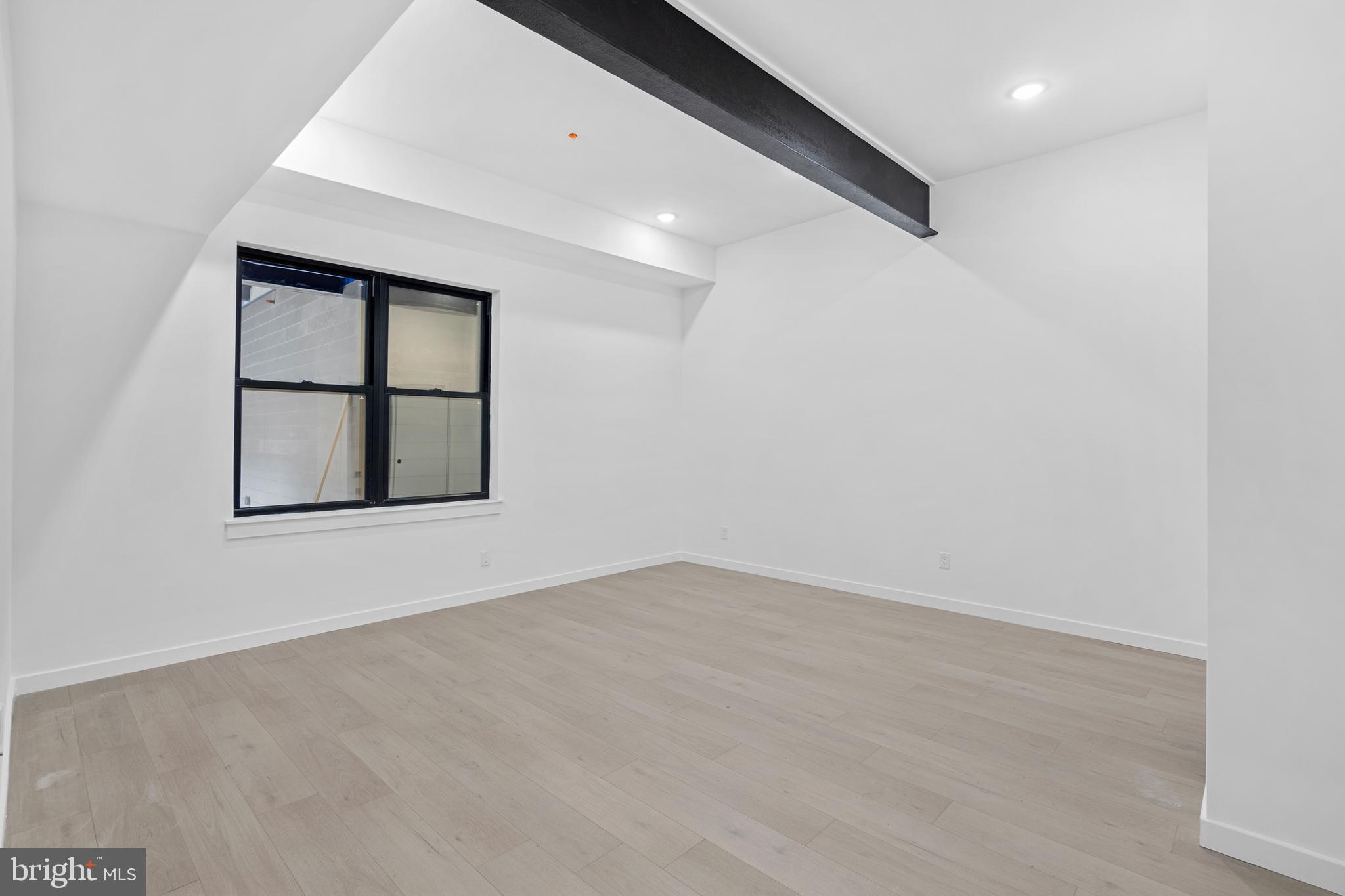 3211 Cedar Street, Unit 2002 Philadelphia, PA 19134 - Photo 16 of 19 an empty room with windows