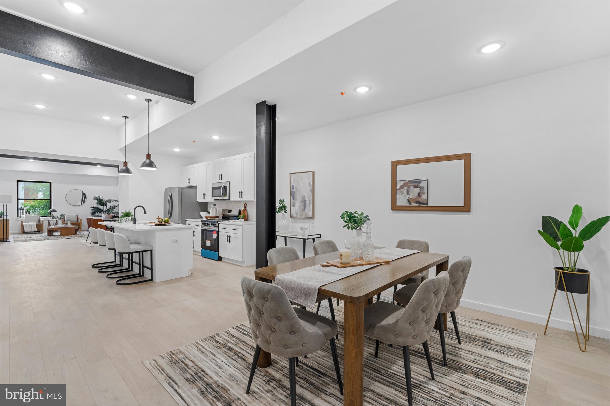 3211 Cedar Street, Unit 2002 Philadelphia, PA 19134 - Photo 2 of 19 a dining room with furniture and wooden floor