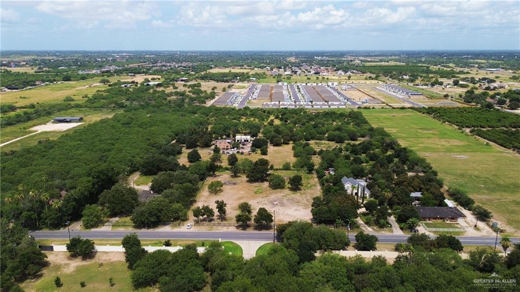 an aerial view of residential building and lake