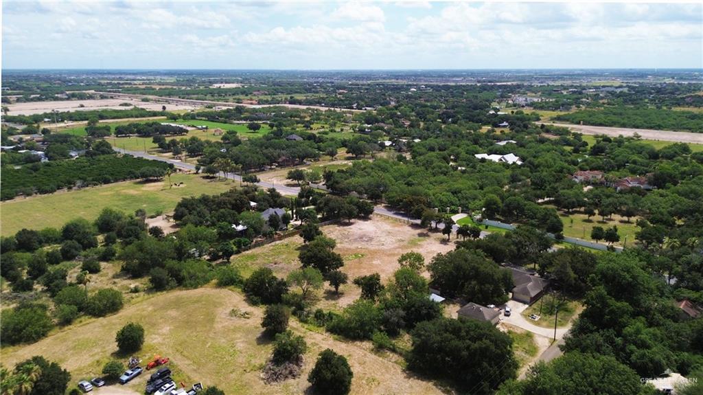 6901 North Taylor Road Mission, TX 78573 - Photo 2 of 5 an aerial view of residential houses with outdoor space and trees
