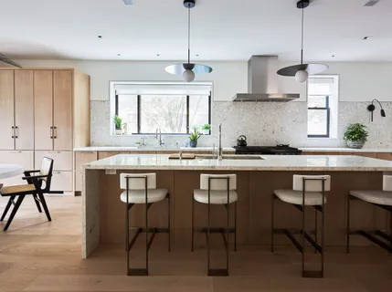 a kitchen with stainless steel appliances a sink and a stove