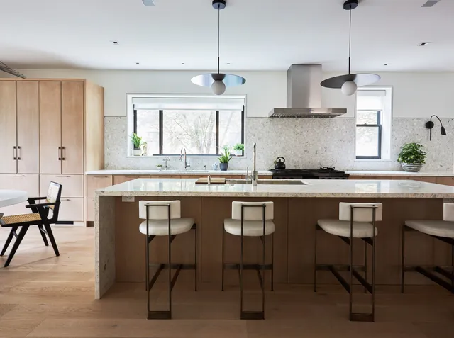 a kitchen with stainless steel appliances a sink and a stove