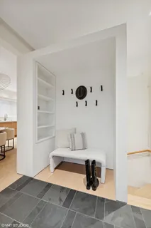 a dining room with table chairs and wooden floor