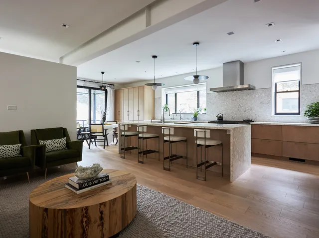 a living room with furniture and windows