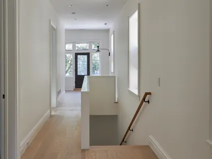 a bedroom with a bed a couch and dresser