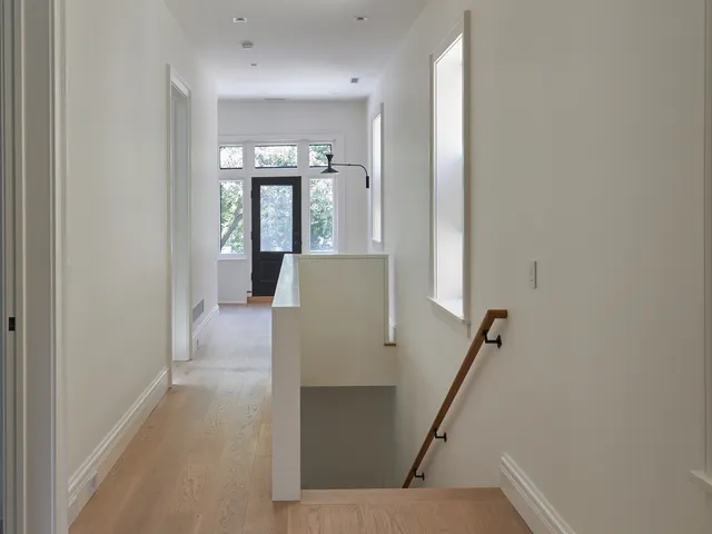 a bedroom with a bed a couch and dresser