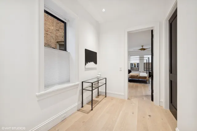 a bedroom with a bed a couch and dresser