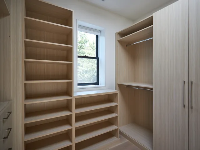 a view of a room that has a large window