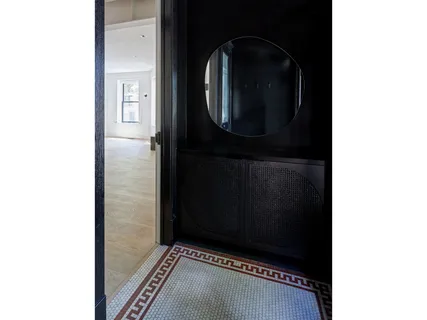 a living room with furniture a dining table and a bookshelf