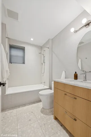 a kitchen with a sink a stove and cabinets