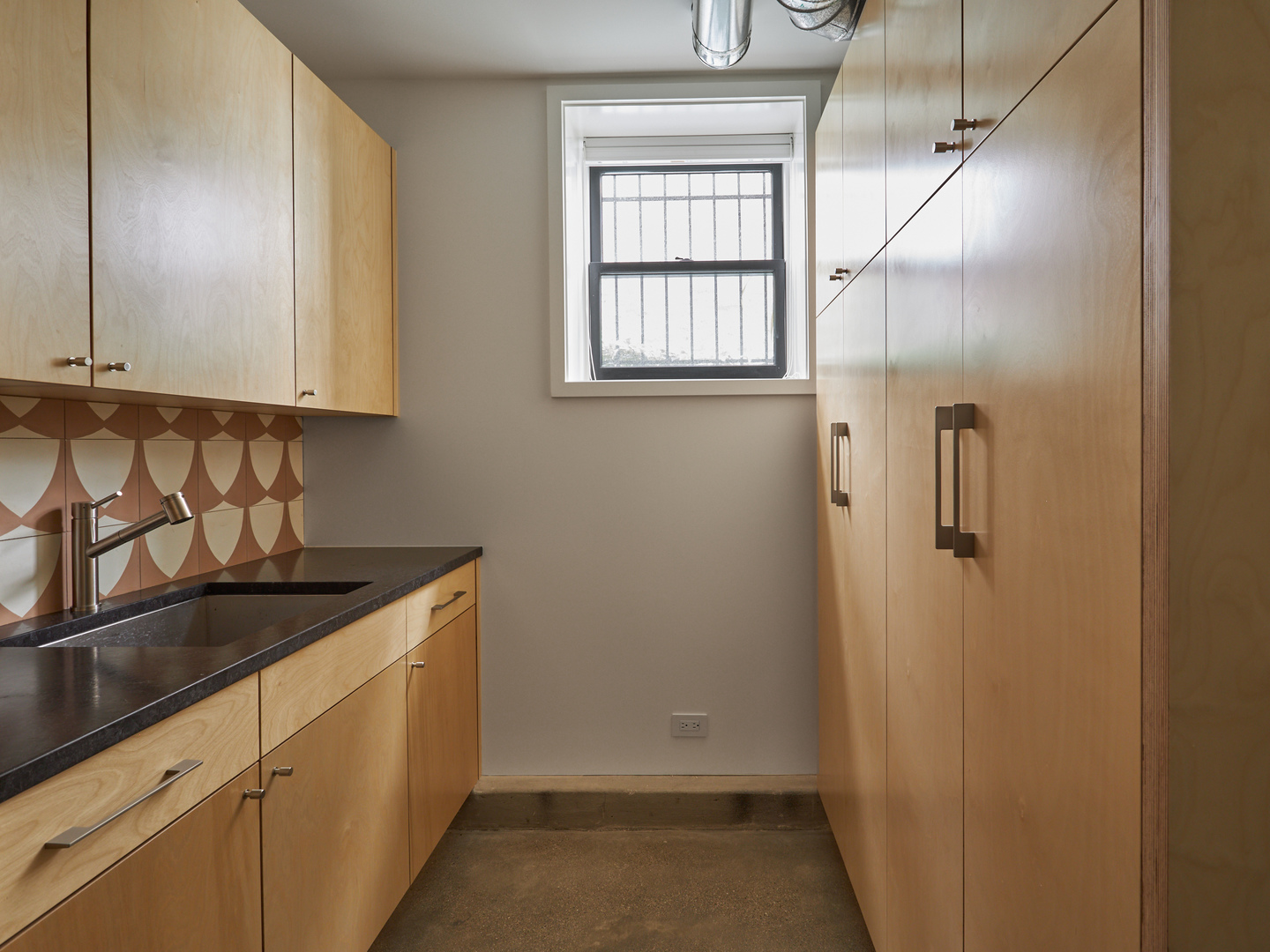 2039 North Humboldt Boulevard Chicago, IL 60647 - Photo 47 of 49 a bathroom with a sink and cabinets