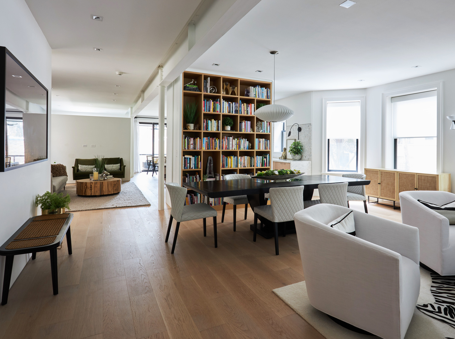 2039 North Humboldt Boulevard Chicago, IL 60647 - Photo 5 of 49 a living room with furniture a dining table and a bookshelf