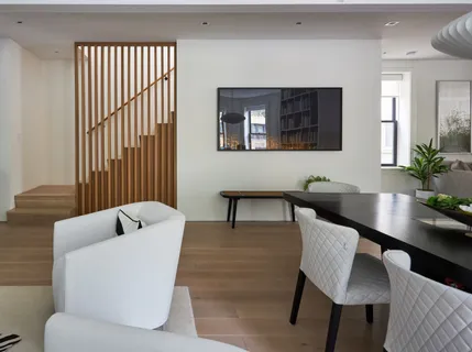 a view of a dining room with furniture and window