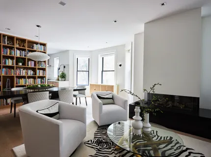 a view of a living room and dining room